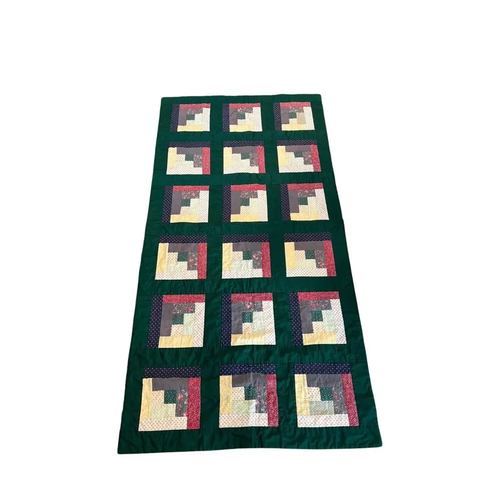 Vintage handmade log cabin quilt with green borders